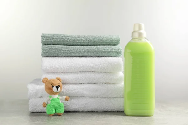 Bottle Laundry Detergent Stacked Fresh Towels Knitted Bear Toy Grey — 스톡 사진