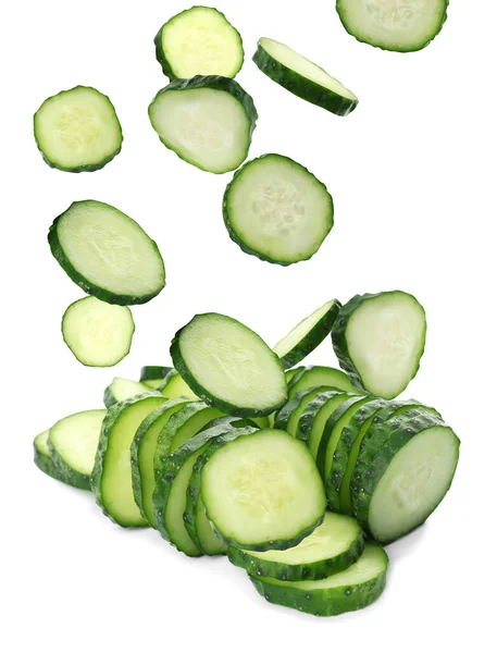 Slices Fresh Green Cucumbers Falling White Background — Stockfoto