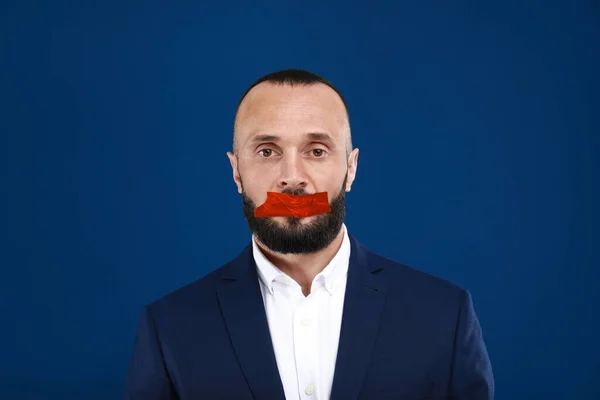 Mature Man Taped Mouth Blue Background Speech Censorship — Stok fotoğraf