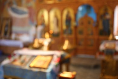 Blurred view of beautiful church interior with ecclesiastical icons