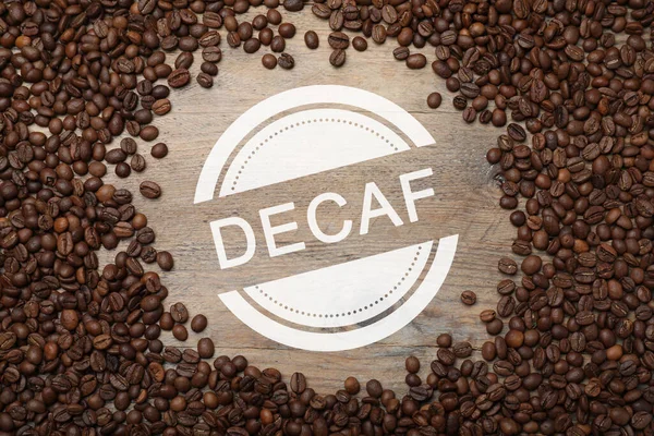Frame Decaf Coffee Beans Wooden Table Flat Lay — Stockfoto