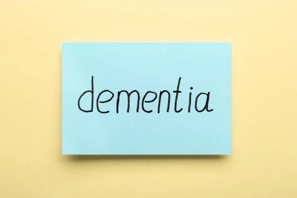 Paper Note Word Dementia Beige Background Top View — Stockfoto