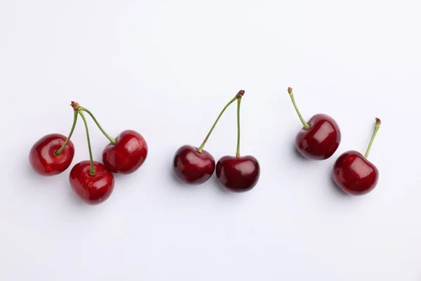 Many Ripe Sweet Cherries White Background Flat Lay — стоковое фото