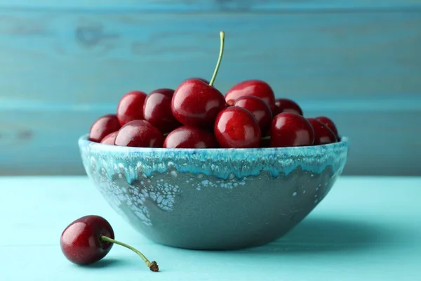 Fresh Ripe Cherries Bowl Turquoise Wooden Table Closeup — стоковое фото