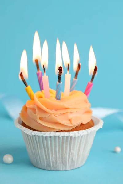 Tasty Birthday Cupcake Many Candles Light Blue Background Closeup — Stockfoto