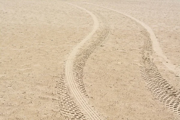 Sandy Beach Tire Tracks Background — стоковое фото