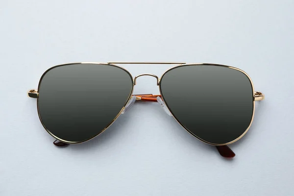 New Stylish Elegant Sunglasses White Background Top View — Zdjęcie stockowe