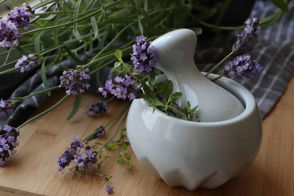 Mortar Fresh Lavender Flowers Green Twigs Pestle Wooden Table — Zdjęcie stockowe