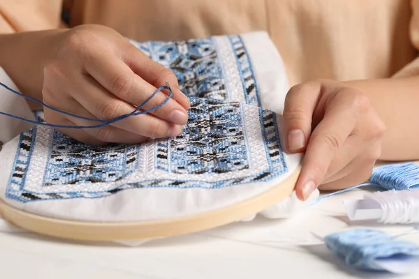 Woman Embroidering Shirt Blue Thread Table Closeup Ukrainian National Clothes — Stockfoto