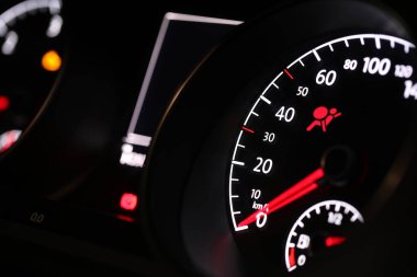 Closeup view of dashboard with warning icon check airbag system in car