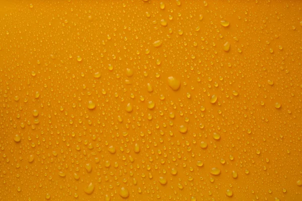 Veel Water Druppels Fel Oranje Achtergrond — Stockfoto
