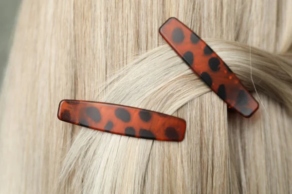 Woman with beautiful hair clips, closeup view