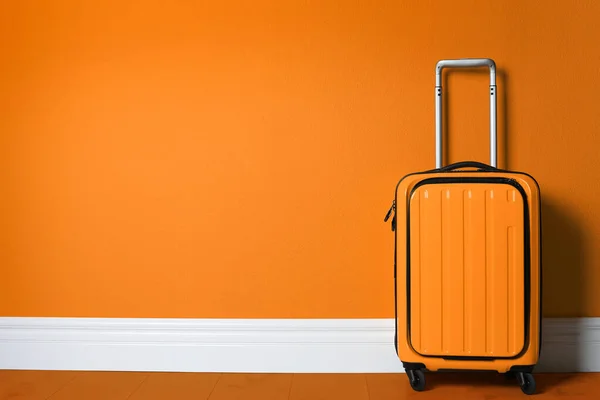 Bright Suitcase Orange Wall Space Text —  Fotos de Stock