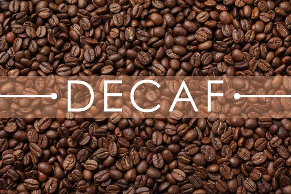Stapel Cafeïnevrije Koffiebonen Als Achtergrond Bovenaanzicht — Stockfoto