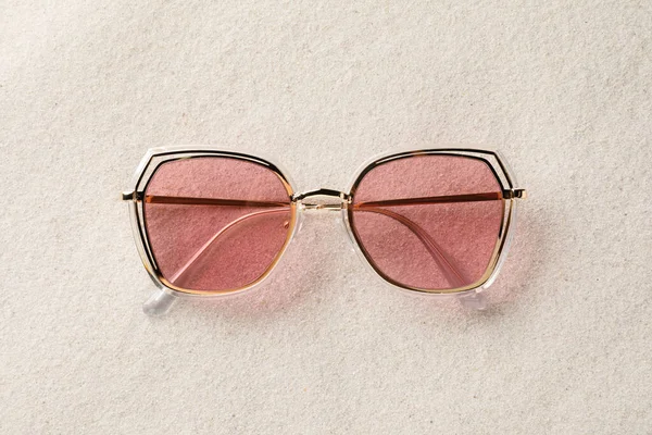 New Stylish Sunglasses Sand Top View — Zdjęcie stockowe