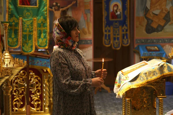 Mature Woman Holding Burning Candle Church — Foto Stock