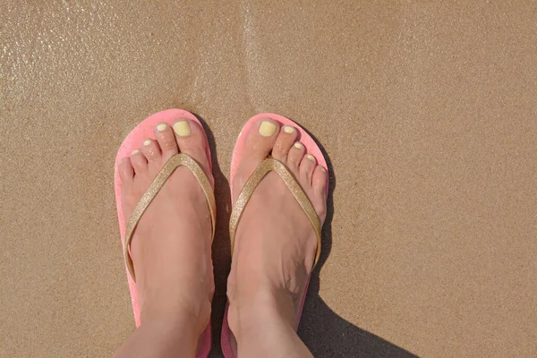 Woman Stylish Pink Flip Flops Standing Wet Sand Top View — 图库照片