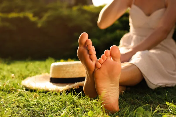 Woman Sitting Barefoot Green Grass Outdoors Closeup Space Text — Stock Fotó