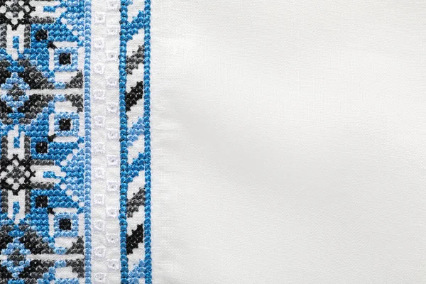 Beautiful Light Blue Ukrainian National Embroidery White Fabric Top View — Fotografia de Stock