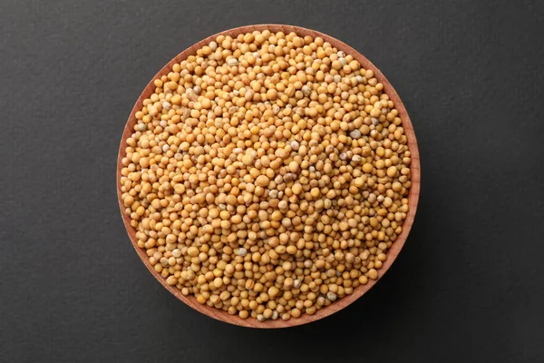 Bowl Mustard Seeds Grey Background Top View — стоковое фото