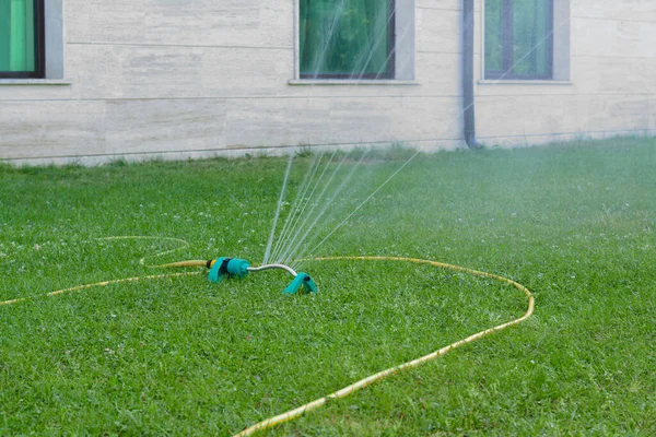 Automatic Sprinkler Watering Green Grass Lawn Outdoors — Stock Fotó