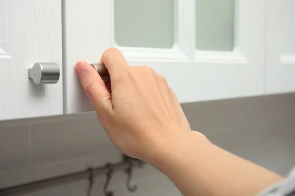 Woman Opening Cabinet Door Home Closeup — Foto de Stock