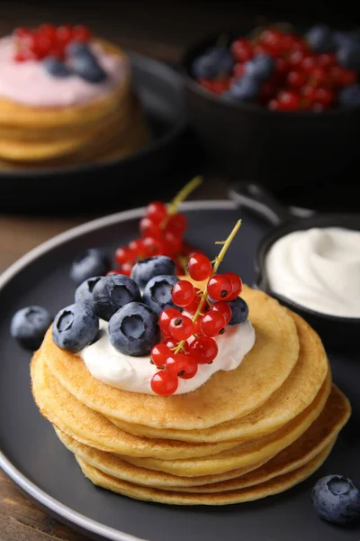 Tasty Pancakes Natural Yogurt Blueberries Red Currants Wooden Table — стоковое фото