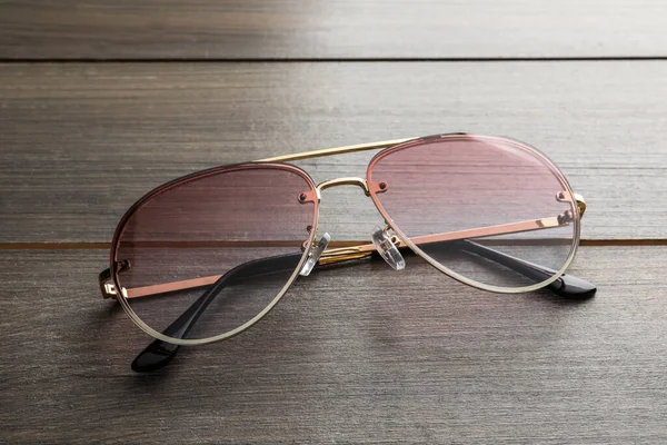 New Stylish Sunglasses Wooden Table Closeup — Photo