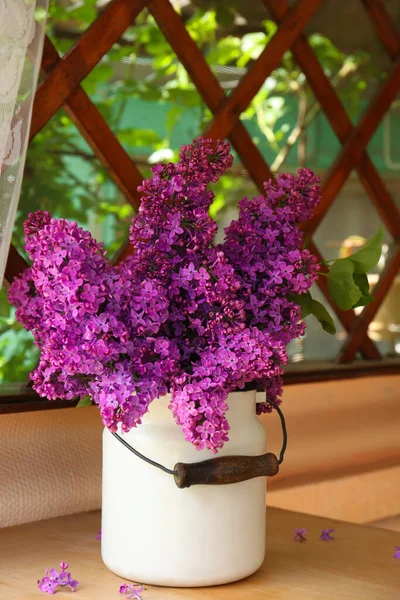 Beautiful Lilac Flowers Milk Can Wooden Table Indoors — ストック写真