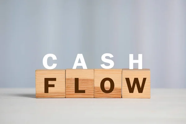 Phrase Cash Flow Made Letters Wooden Cubes Light Background — Stockfoto