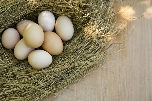 Nest Fresh Raw Eggs Wooden Table Top View Space Text — Foto de Stock