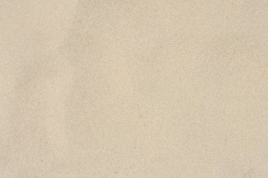 Arka plan olarak kumlu sahil dokusu, üst manzara