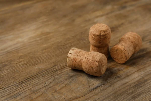 Sparkling Wine Corks Wooden Table Closeup Space Text — Zdjęcie stockowe