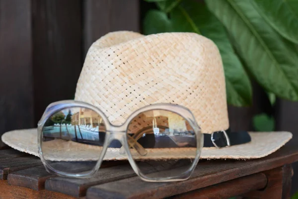 Stylish Hat Sunglasses Wooden Table Closeup Beach Accessories — Stockfoto