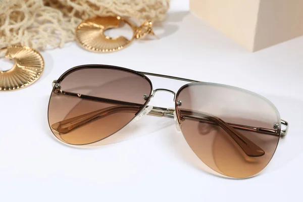 New Stylish Elegant Sunglasses Jewelry White Background Closeup — Stock fotografie