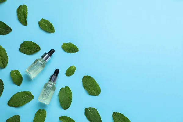 Bottles Essential Oil Mint Light Blue Background Flat Lay Space — Stockfoto