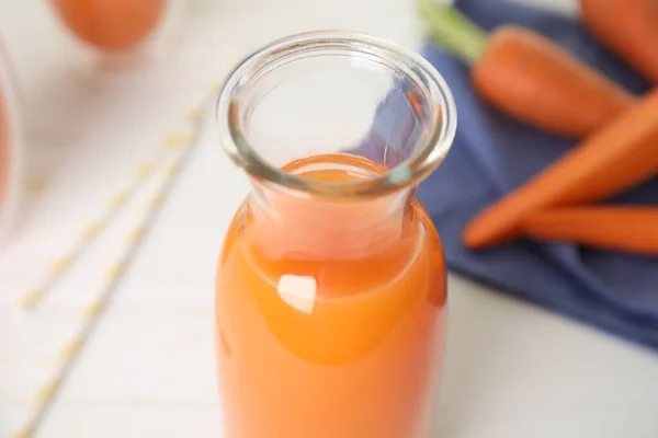 Freshly Made Carrot Juice Glass Bottle White Table Closeup — Foto de Stock