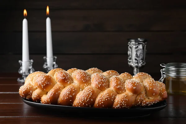 Homemade Braided Bread Sesame Seeds Goblet Candles Wooden Table Traditional — 스톡 사진