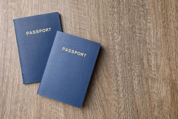 Blank Blue Passports Wooden Table Flat Lay Space Text — Φωτογραφία Αρχείου