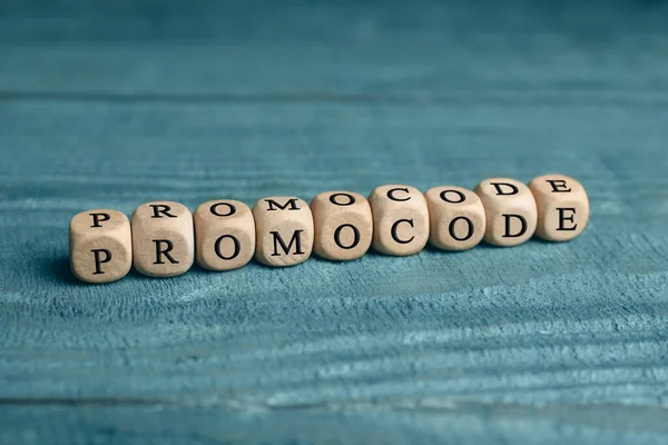 Wooden Cubes Words Promo Code Blue Table — Stockfoto