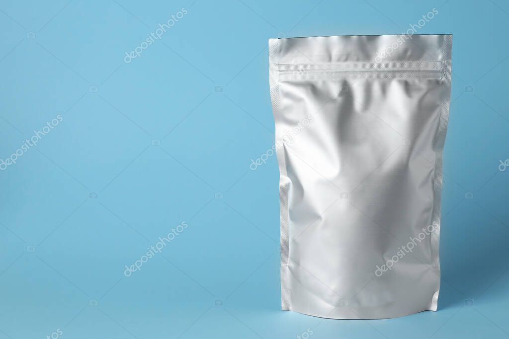 One blank foil package on light blue background. Space for text