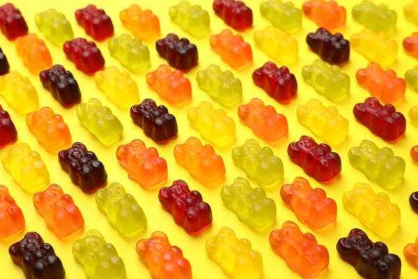 Delicious Gummy Bear Candies Yellow Background — Stockfoto