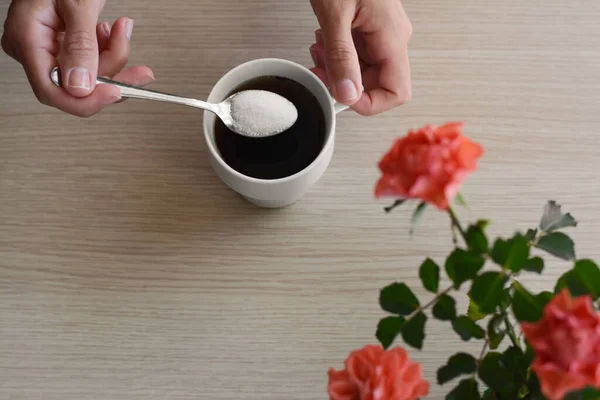 Woman Adding Sugar Morning Coffee Wooden Table Top View — Stockfoto