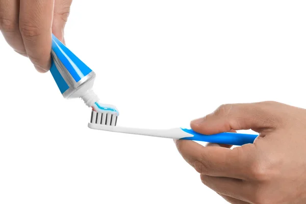 Man Applying Toothpaste Brush White Background Closeup — Stok fotoğraf