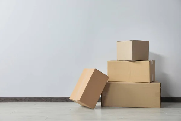 Many Closed Cardboard Boxes Floor White Wall Space Text Delivery — Stock Photo, Image