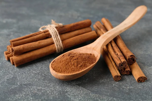 Aromatic Cinnamon Powder Sticks Grey Table Closeup — Stock Photo, Image