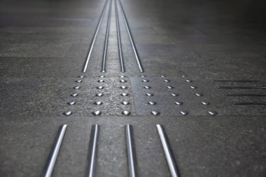 Floor tiles with tactile ground surface indicators, closeup view