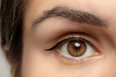 Beautiful woman with hazel eye, closeup view