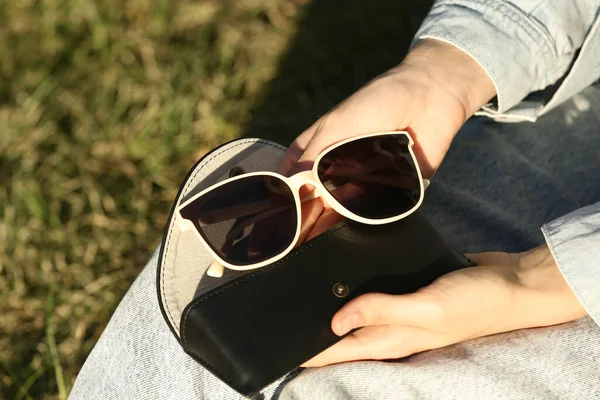 Woman Holding Sunglasses Case Outdoors Sunny Day Closeup — 스톡 사진