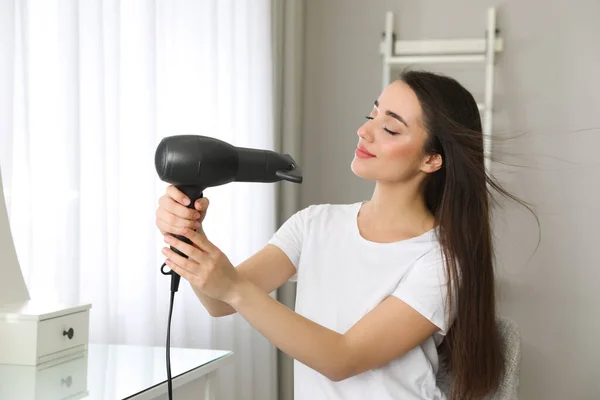 Beautiful Young Woman Using Hair Dryer Home — Stock Photo, Image